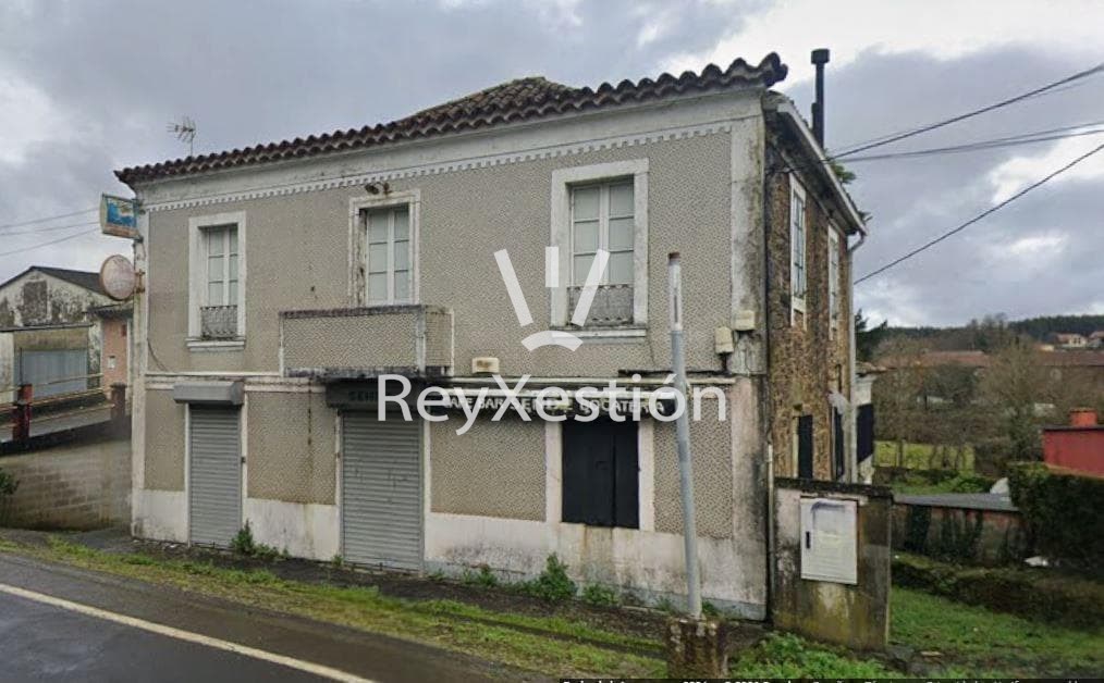 Foto 2 CASA UNIFAMILIAR DE PEDRA (con terreno e dúas naves multiuso) en Lavacolla