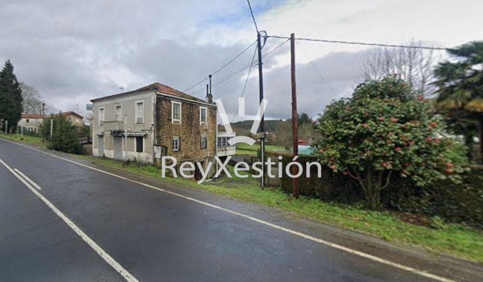 Foto 3 CASA UNIFAMILIAR DE PEDRA (con terreno e dúas naves multiuso) en Lavacolla